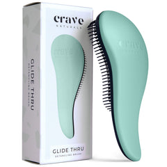Crave Naturals Glide Thru Detangling Brush turquoise close-up for smooth glide through knots.