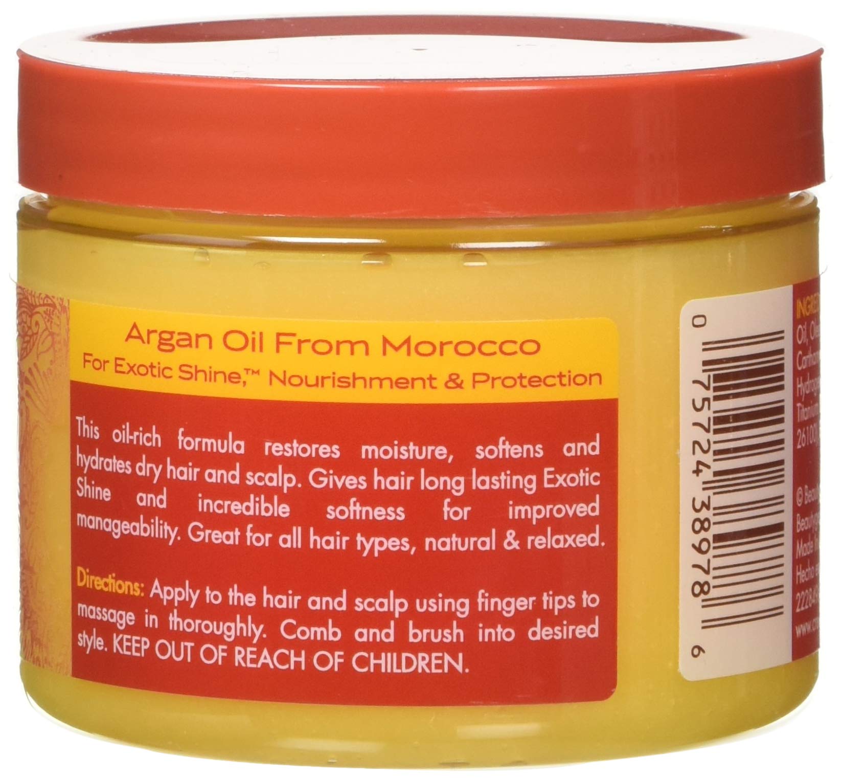 Creme of Nature Argan Oil Day & Night bottle being poured for easy daily use