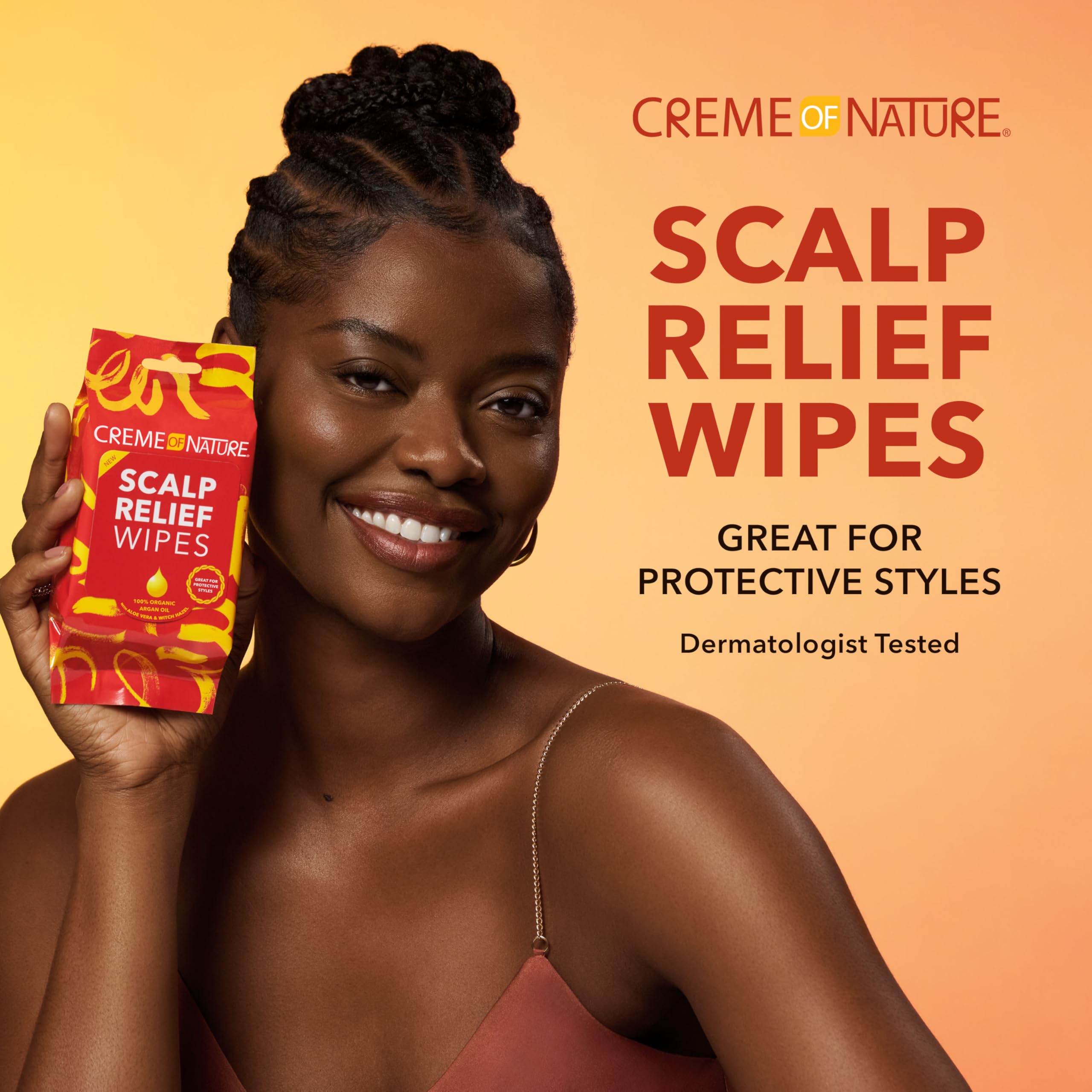 Creme of Nature Argan Oil Scalp Relief Wipes applied to scalp for soothing refresh