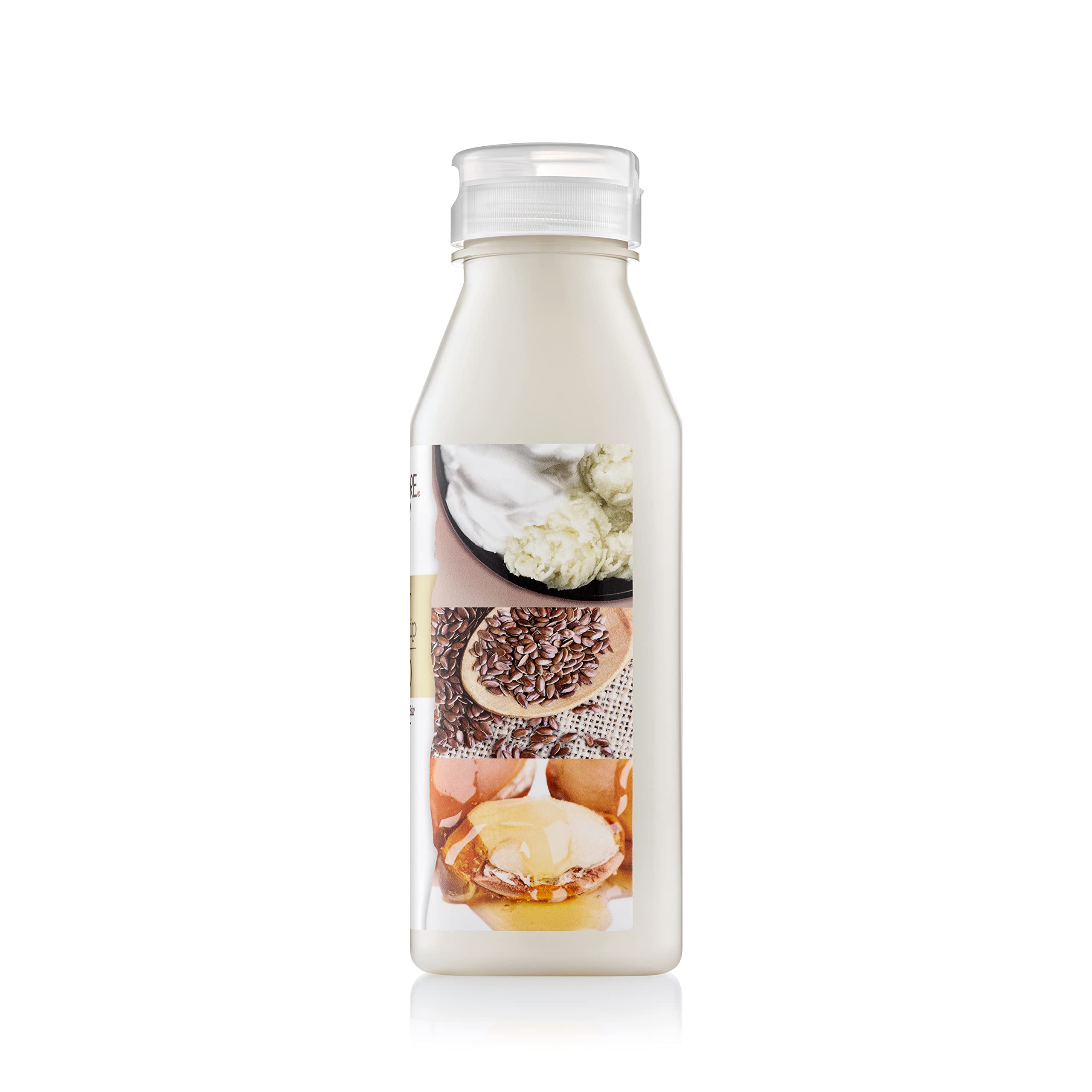 Close-up of Creme of Nature bottle label with Butter Blend and flaxseed-argan benefits.