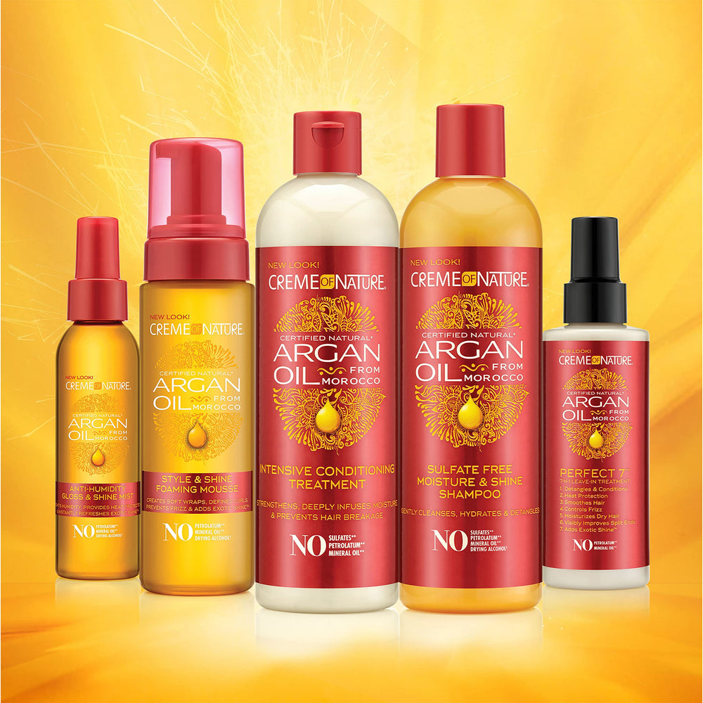 Creme of Nature frizz control serum taming flyaways during styling.