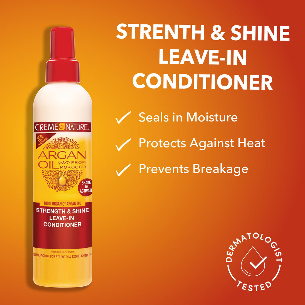 Close-up label detail of Creme of Nature Strength & Shine Leave-In highlighting organic argan oil.