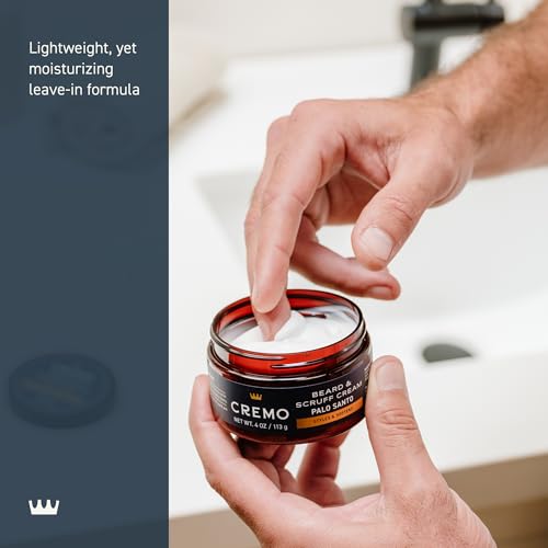 Hands applying Cremo cream to beard for itch relief and manageability