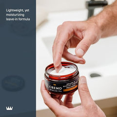 Hands applying Cremo cream to beard for itch relief and manageability