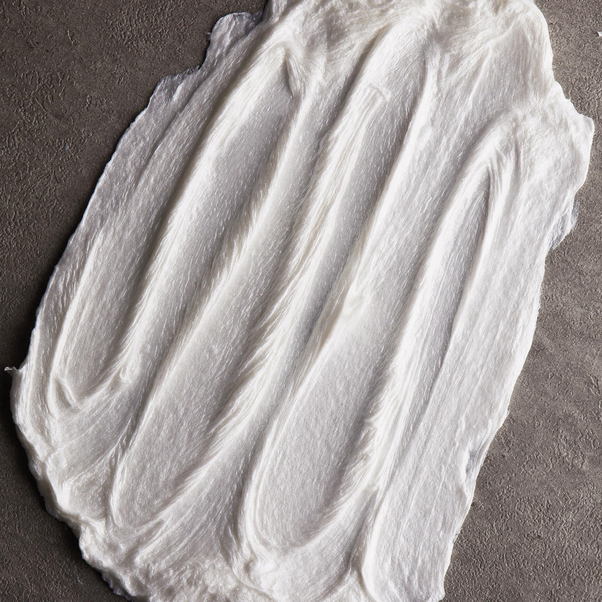 Cremo Sandalwood Shave Cream with a citrus scent for a refreshing shave.