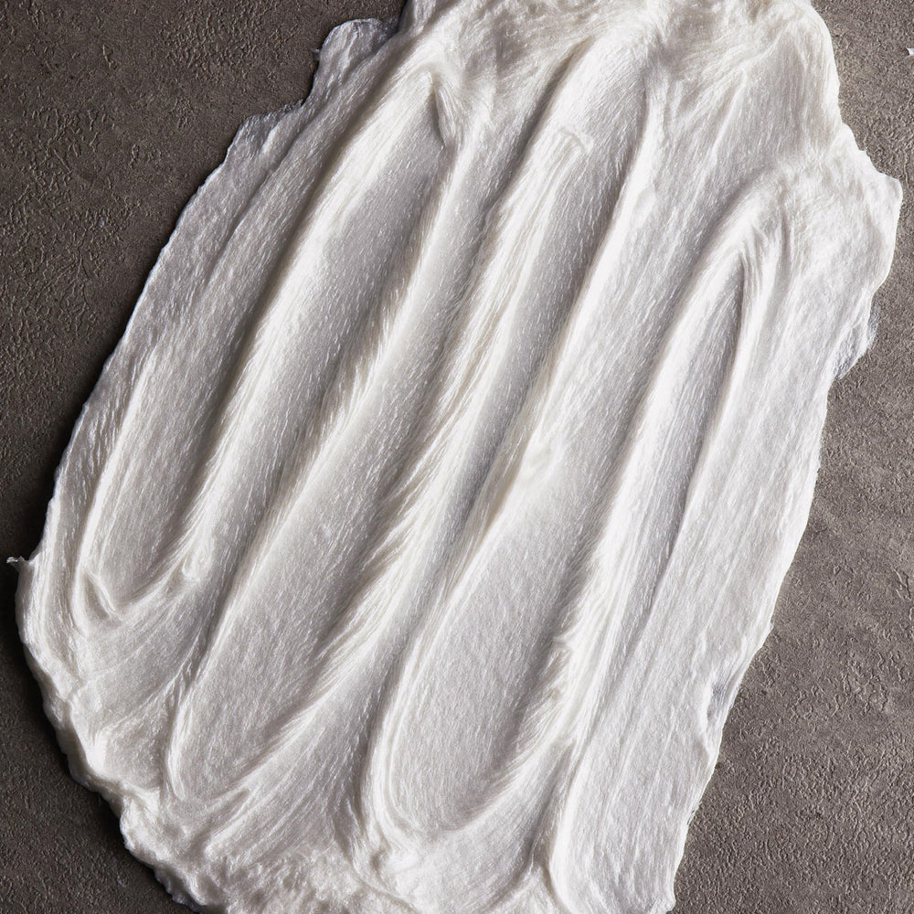 Cremo Sandalwood Shave Cream with a citrus scent for a refreshing shave.