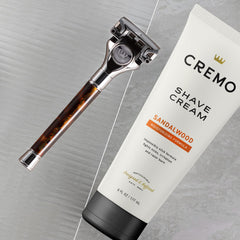Cremo Sandalwood Shave Cream close-up demonstrates razor glide across skin.