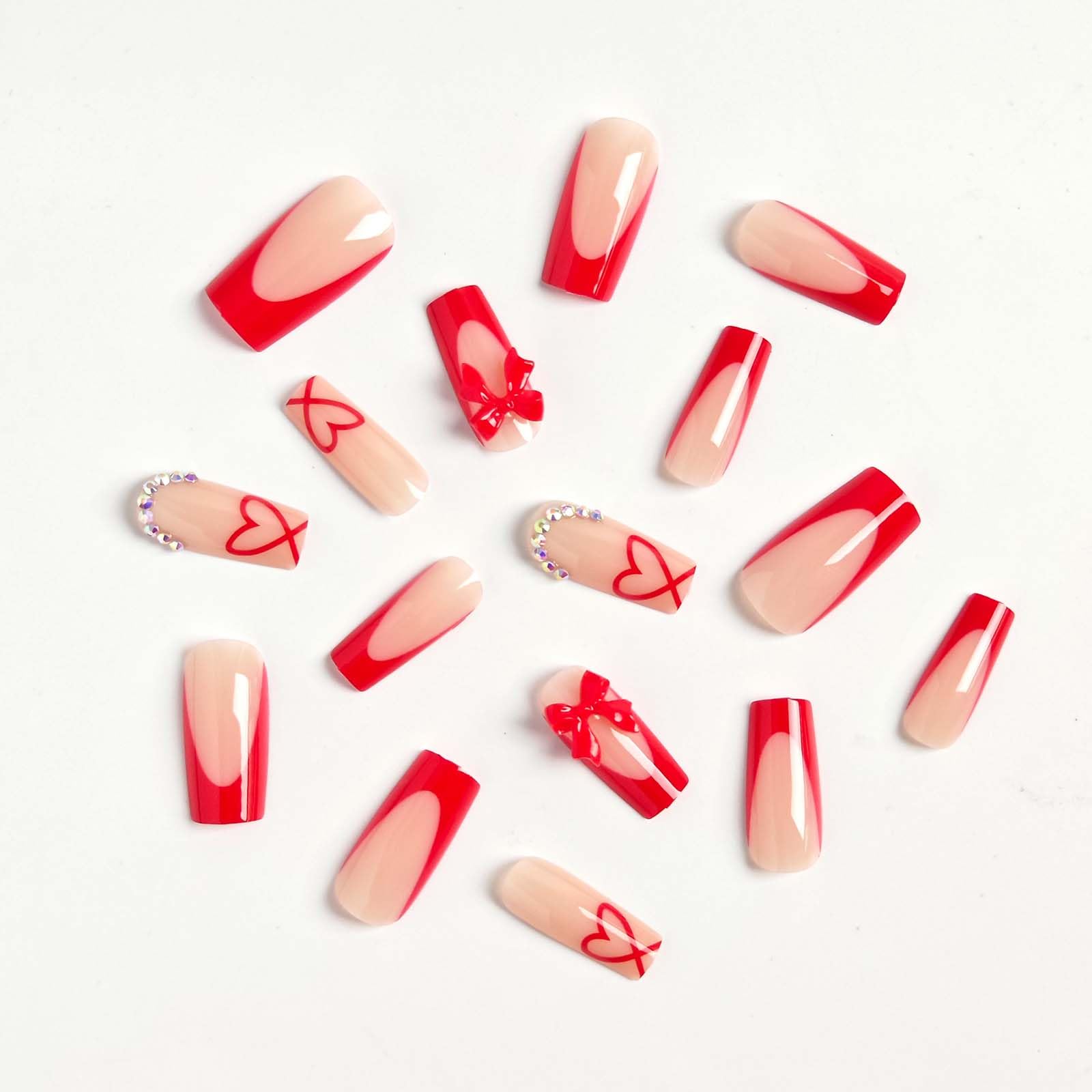 CTTHNBD closeup of red French tip bows and rhinestones on glossy nails