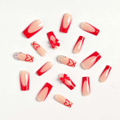 CTTHNBD closeup of red French tip bows and rhinestones on glossy nails