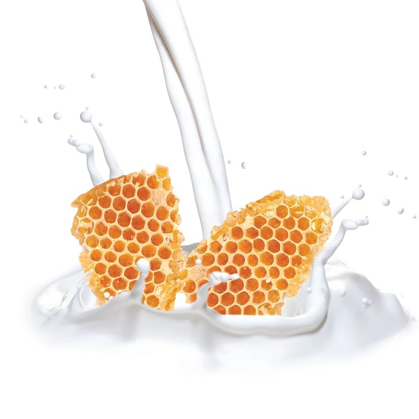 Cuccio Naturale cuticle oil on hands in a spa-at-home setting.