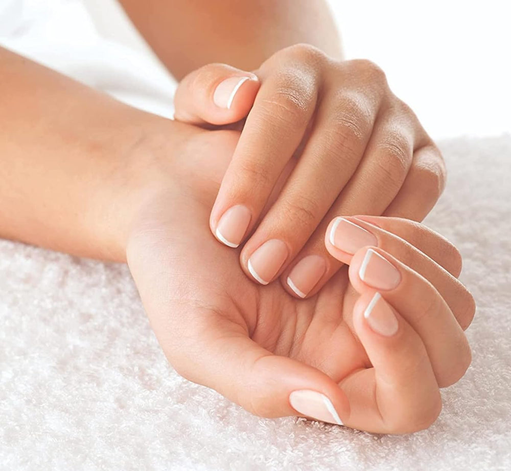 Vitamin E-rich Cuccio Naturale oil with cold-pressed oils for skin around nails.