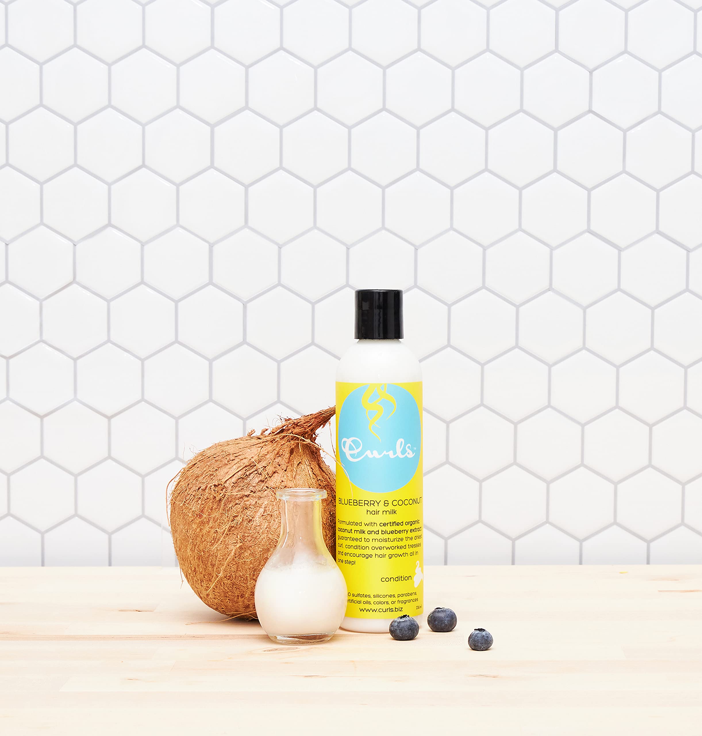 Ingredientes coco y arándano en Curls Blueberry Bliss para nutrición del cabello