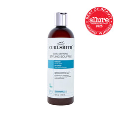 Applying CURLSMITH Soufflé on damp hair for smooth, even distribution.