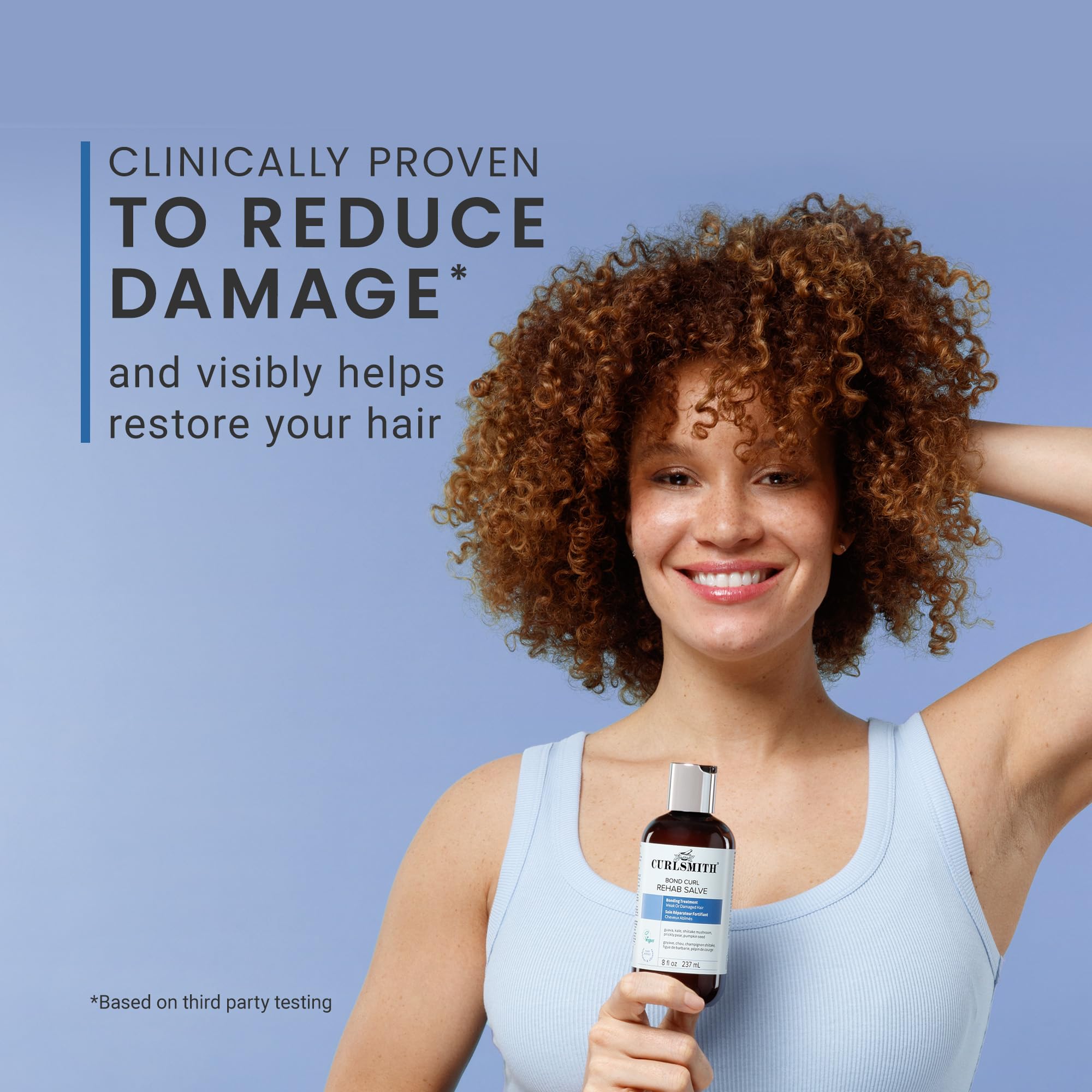 Applying CURLSMITH Bond Curl Rehab Salve to curls before washing for strength support