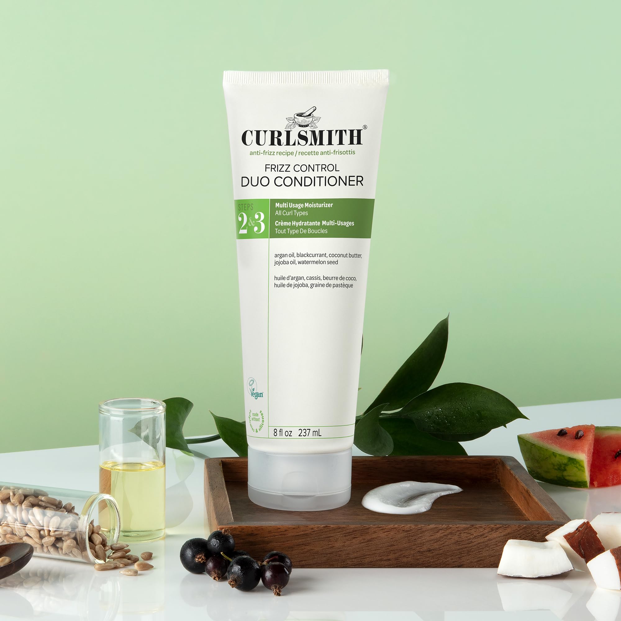 CURLSMITH Frizz Control Duo detangled hair with shine.