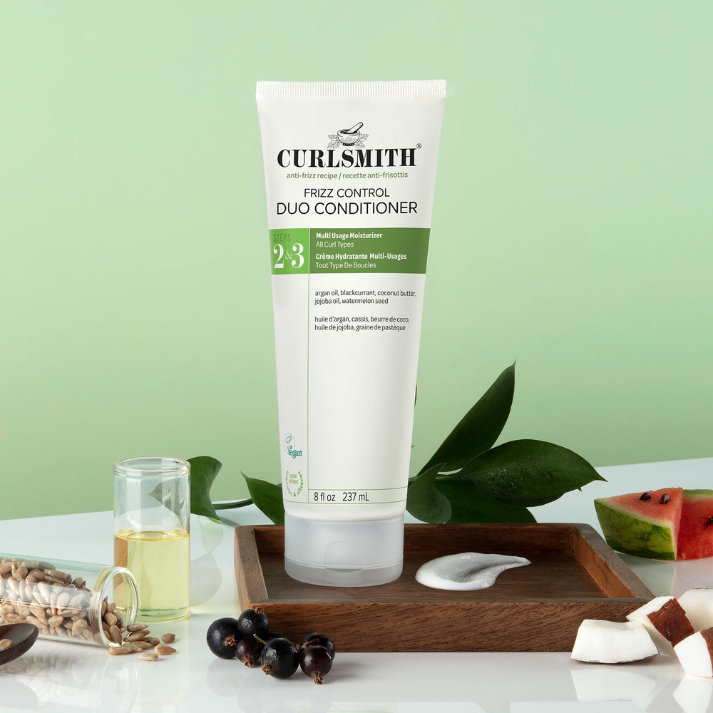 CURLSMITH Frizz Control Duo detangled hair with shine.