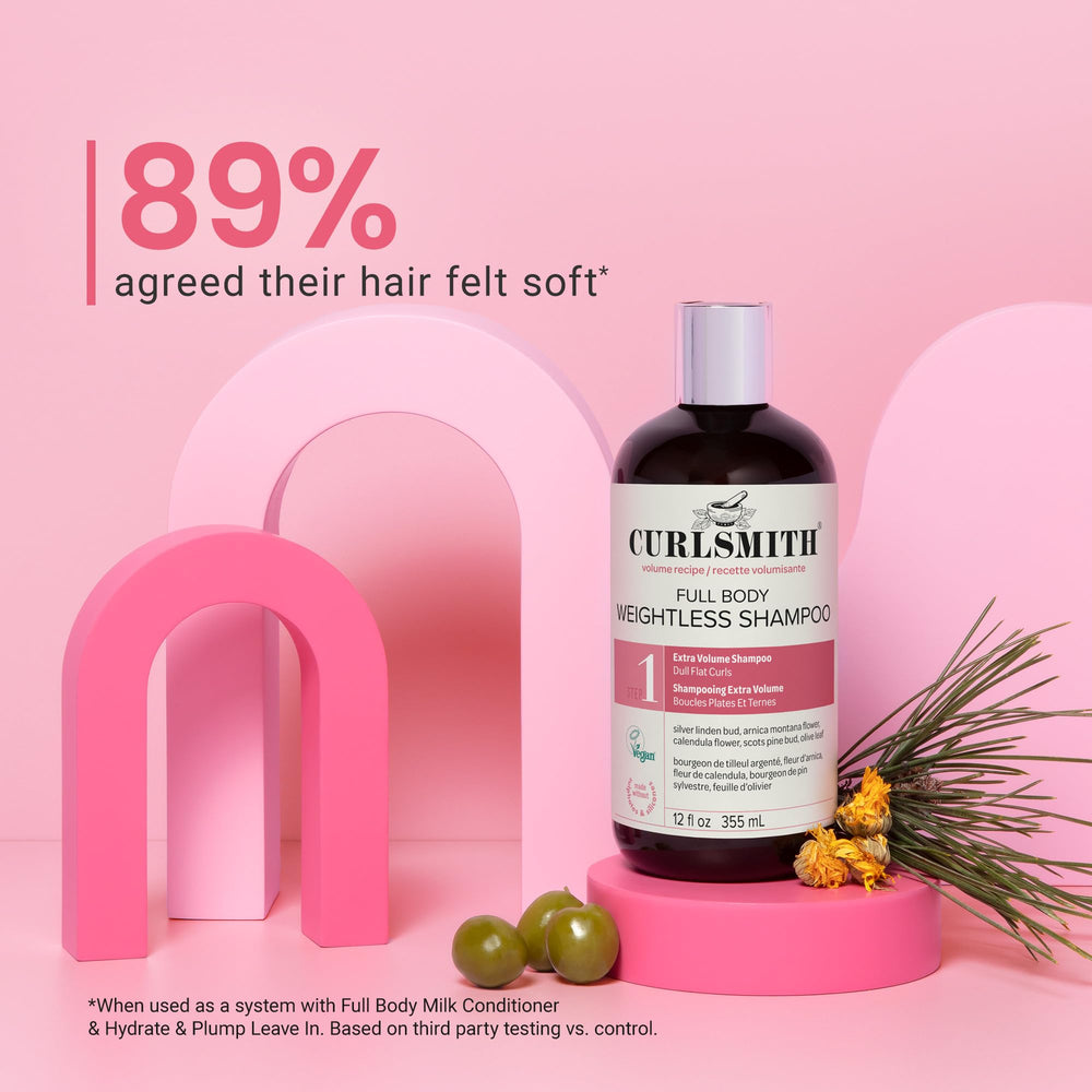 CURLSMITH Full Body Weightless Shampoo on shower shelf emphasizes clean, hydrated curls.