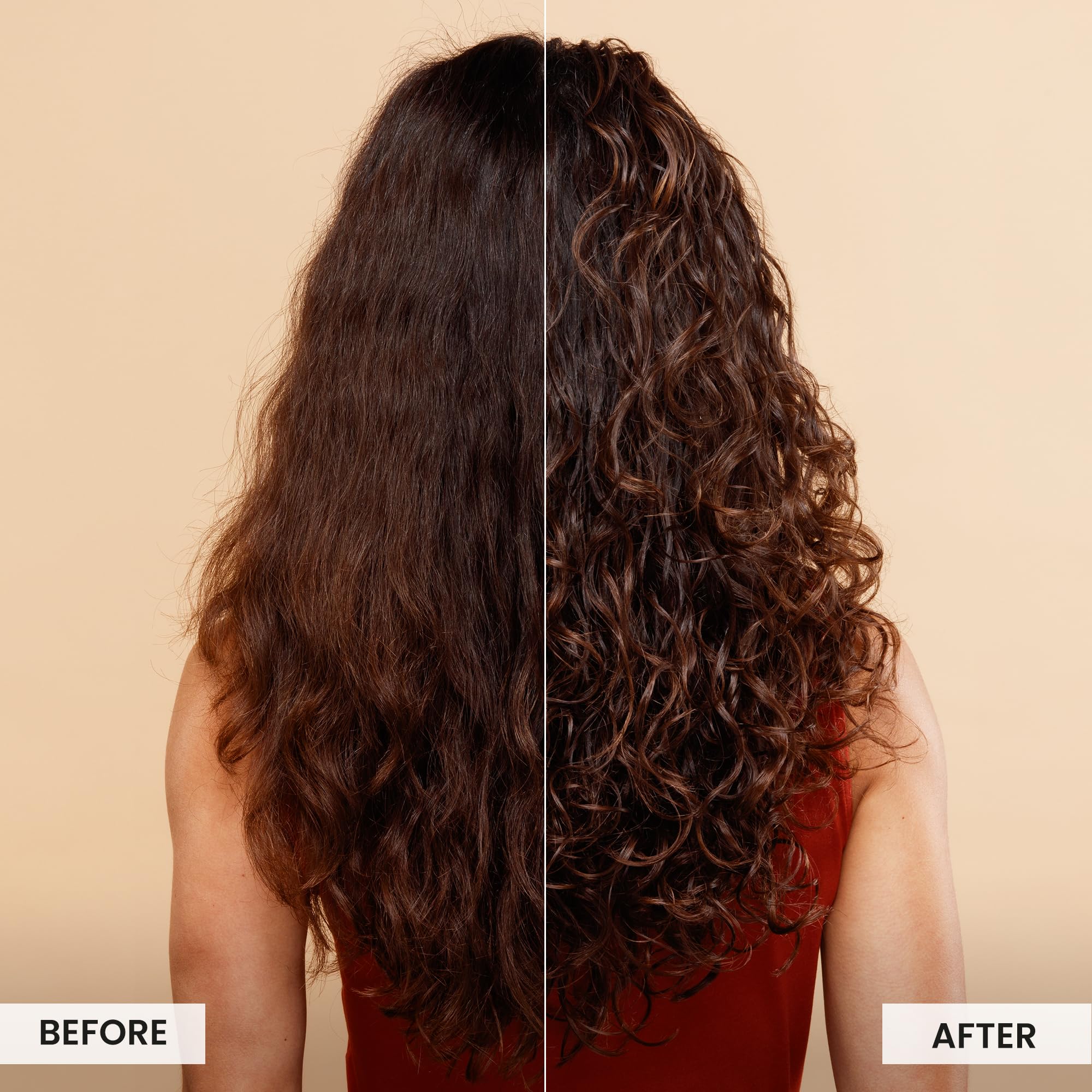 Model applying Miracle Shield on damp hair to revive curls.