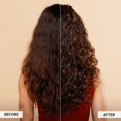 Model applying Miracle Shield on damp hair to revive curls.