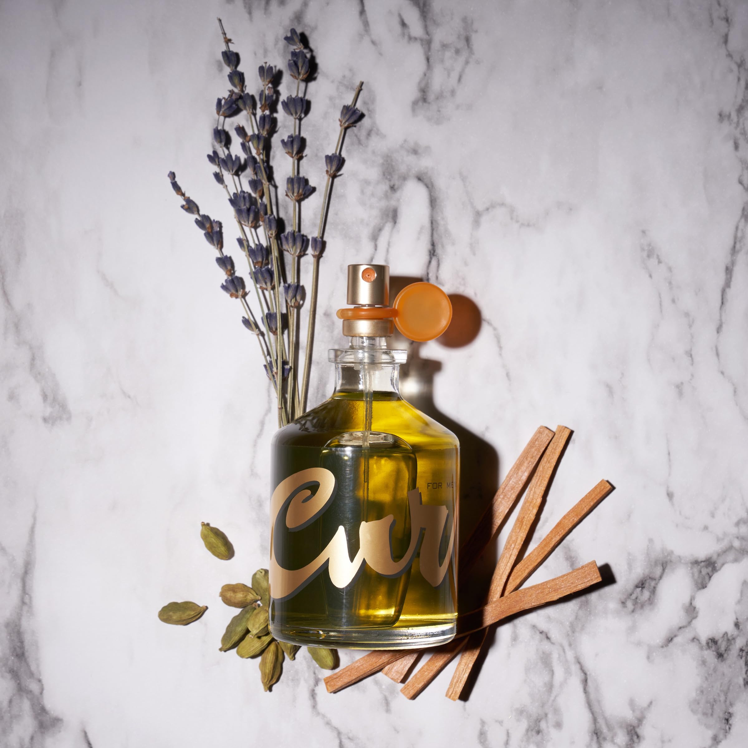 Curve Crush bottle on desk, energetic scent for spontaneous moments.