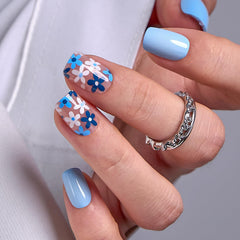 Curvlife uñas postizas acrílicas con flor azul; acabado gel suave para uso diario.