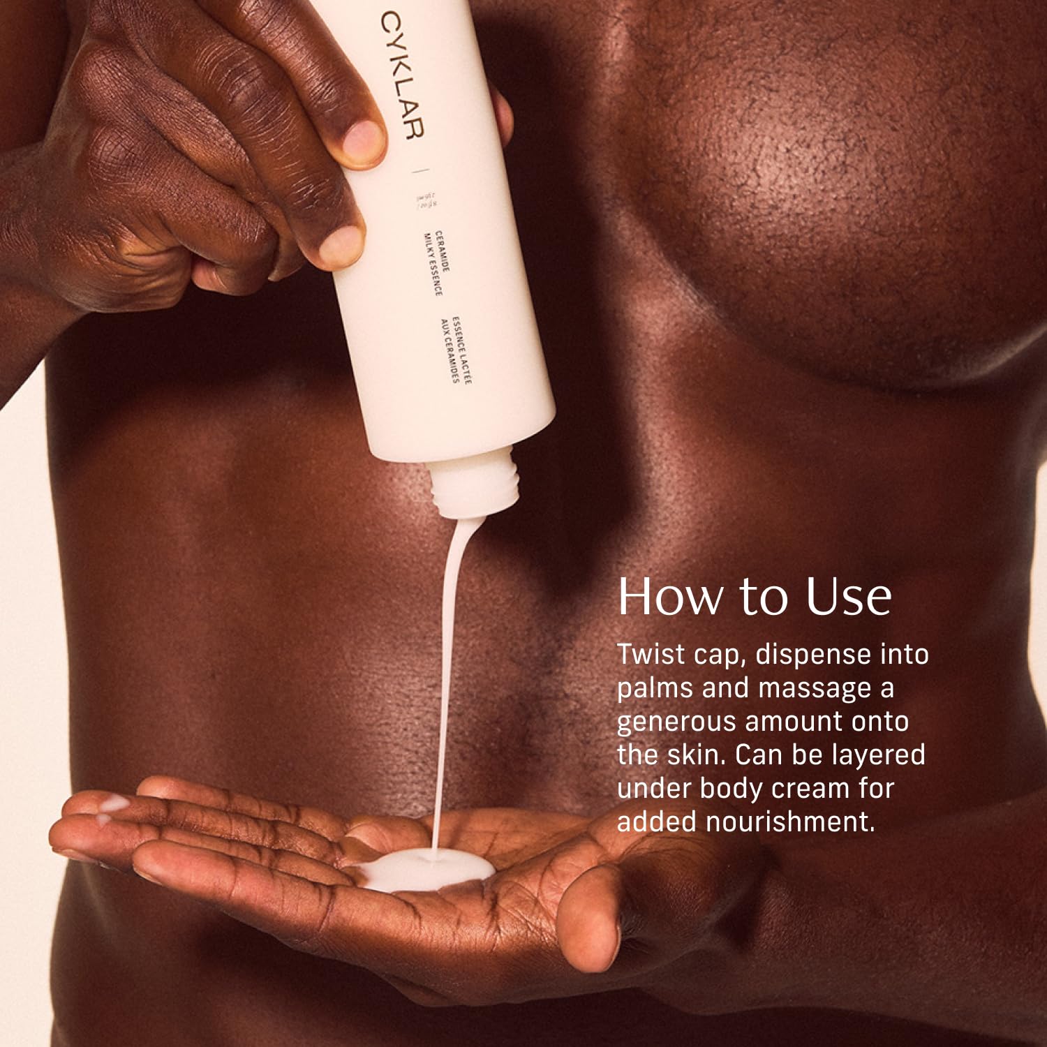 Applying CYKLAR Milky Essence on arms demonstrates daily hydrating routine