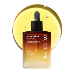 D'Cherlane hair growth oil bottle pour for quick, non-greasy scalp nourishment.
