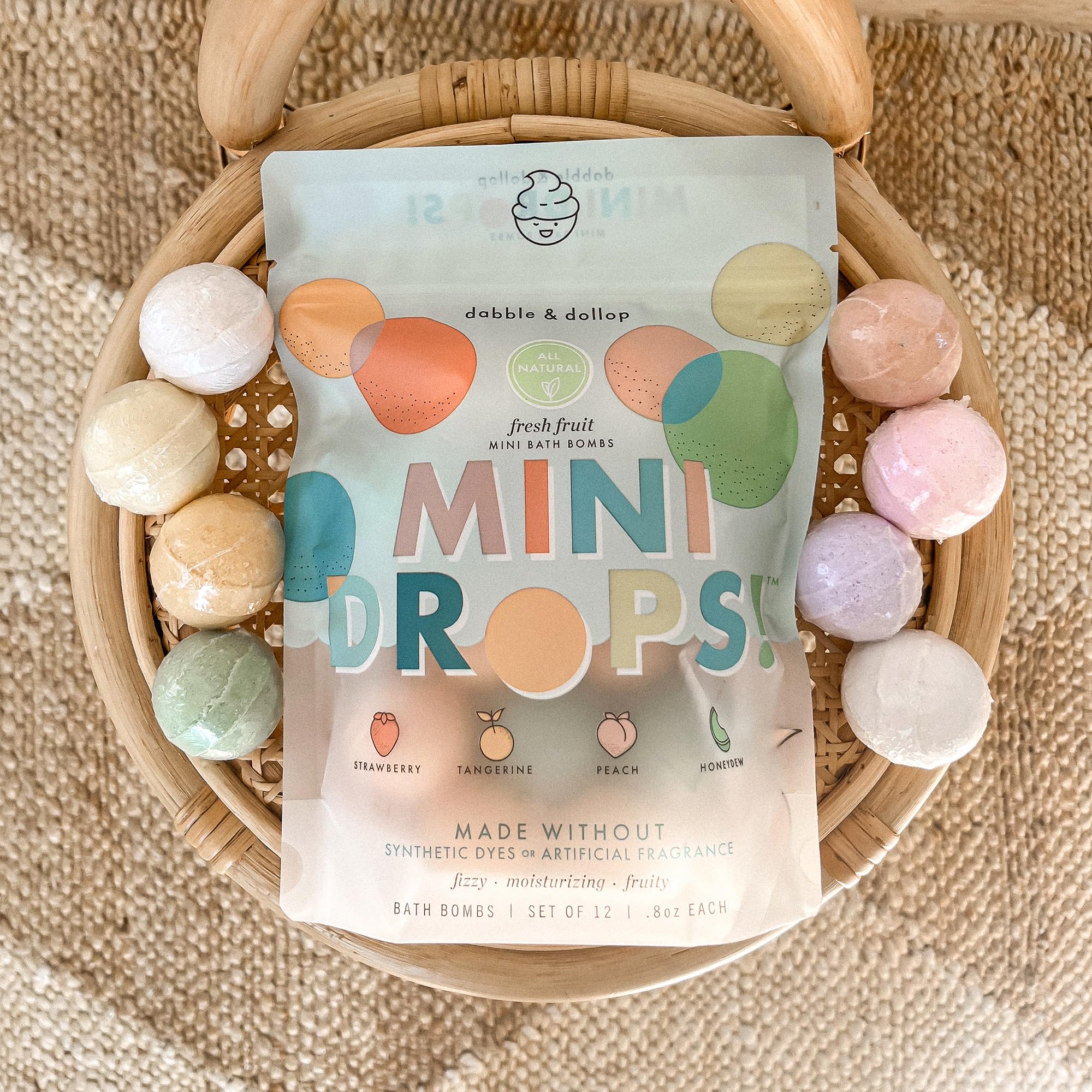 Dabble & Dollop peach-scent mini bath bomb delivering gentle moisture.