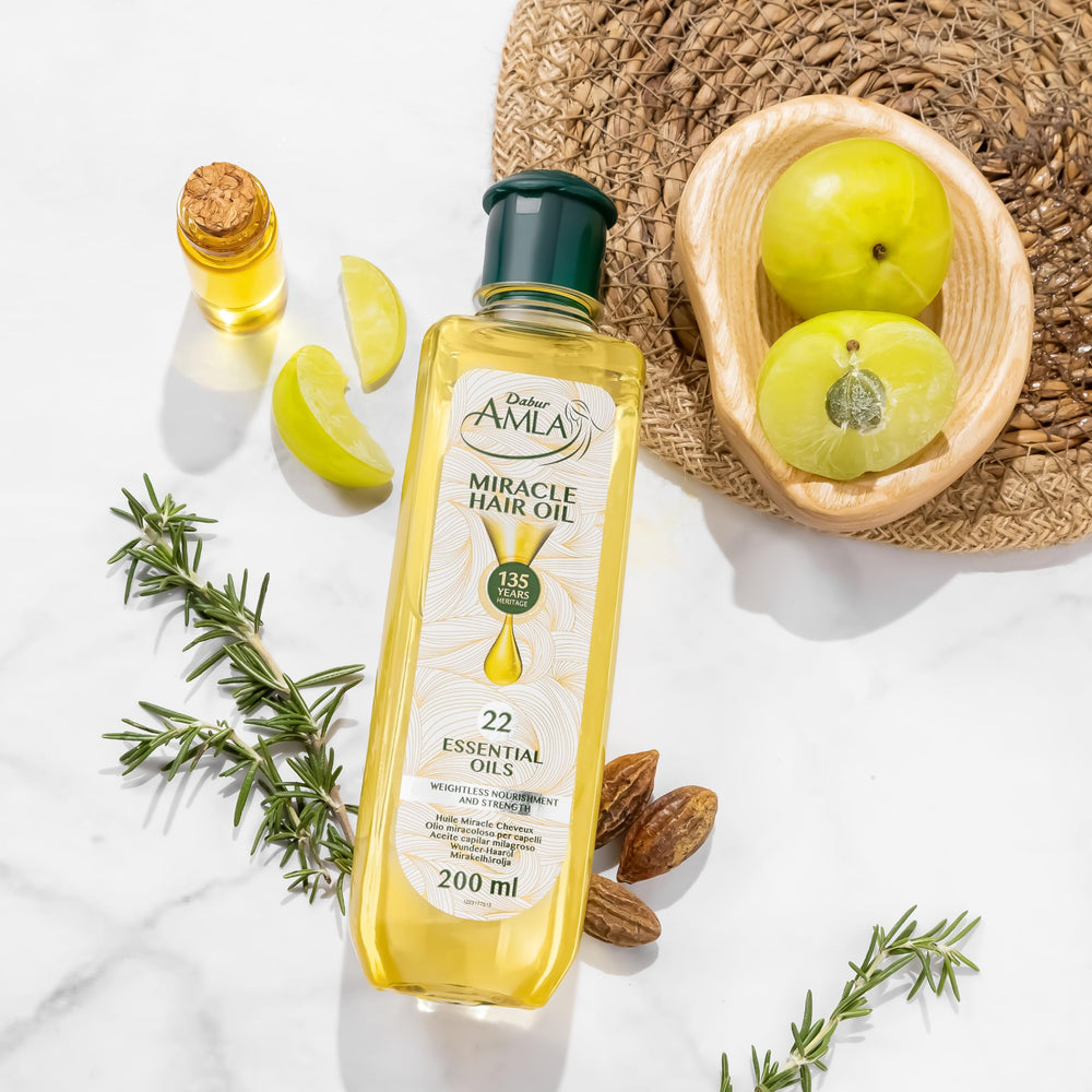 Dabur Amla Luxe Hair Oil on dry hair demonstrating frizz control and shine.