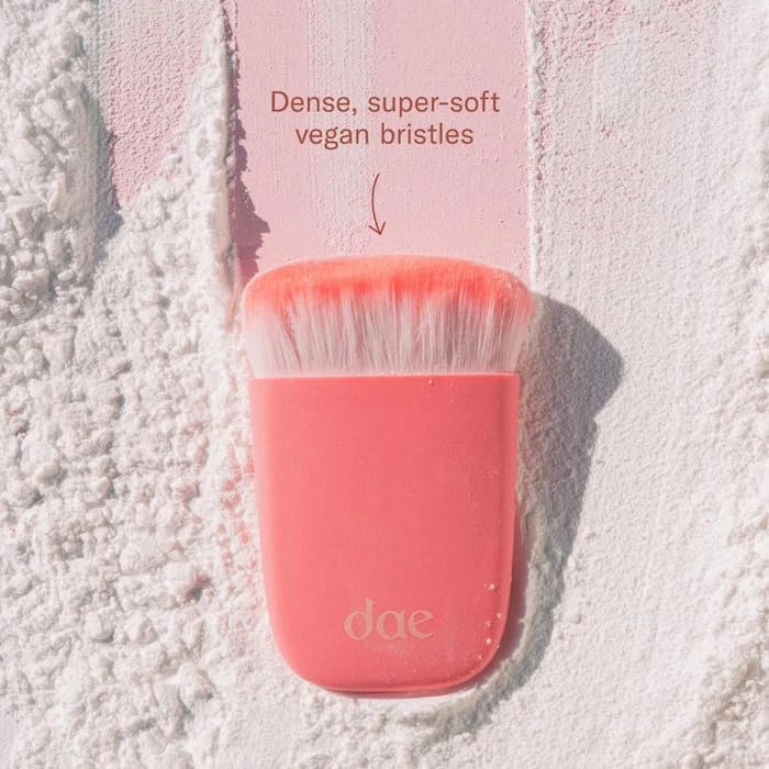 DAE Fairy Duster brush mid-application showing seamless powder distribution at the roots.