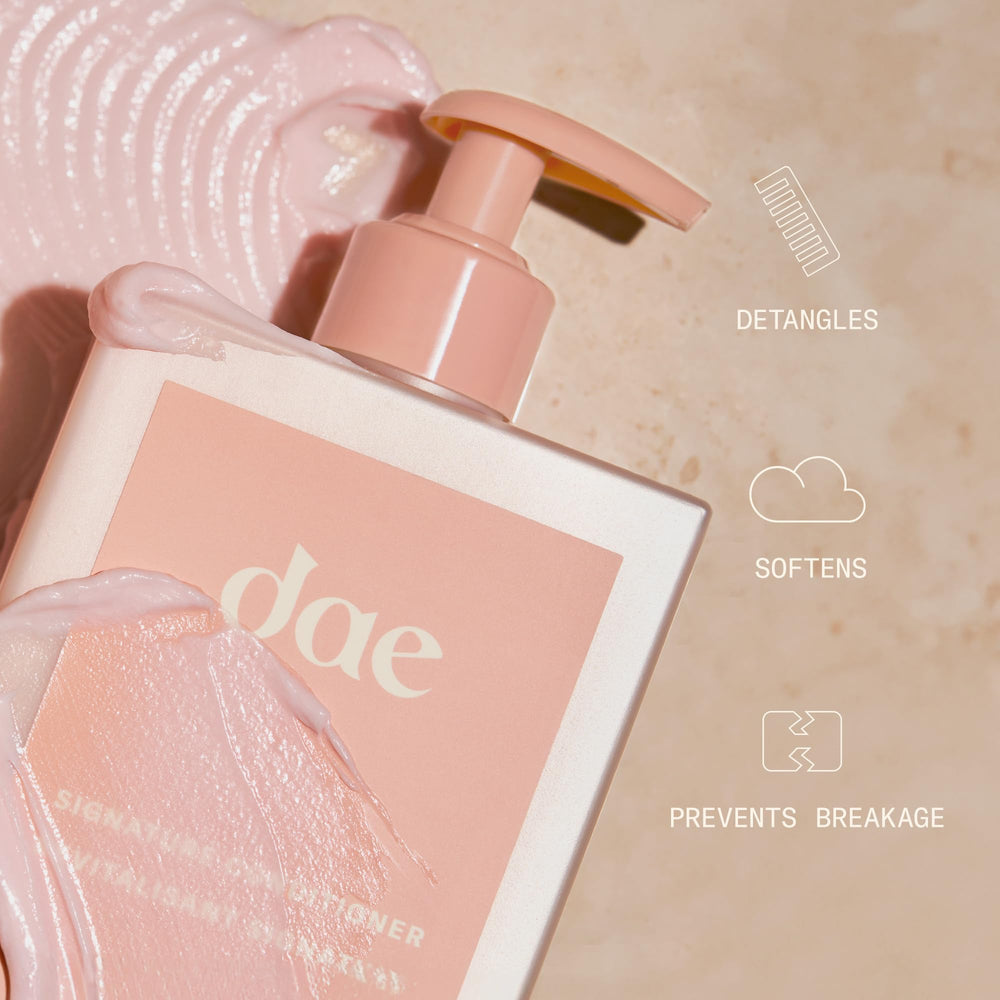 DAE Signature Conditioner glossy texture close-up suggests detangling and smoothness.