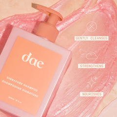 DAE Signature Shampoo label closeup highlights sulfate-free formula and desert botanicals.