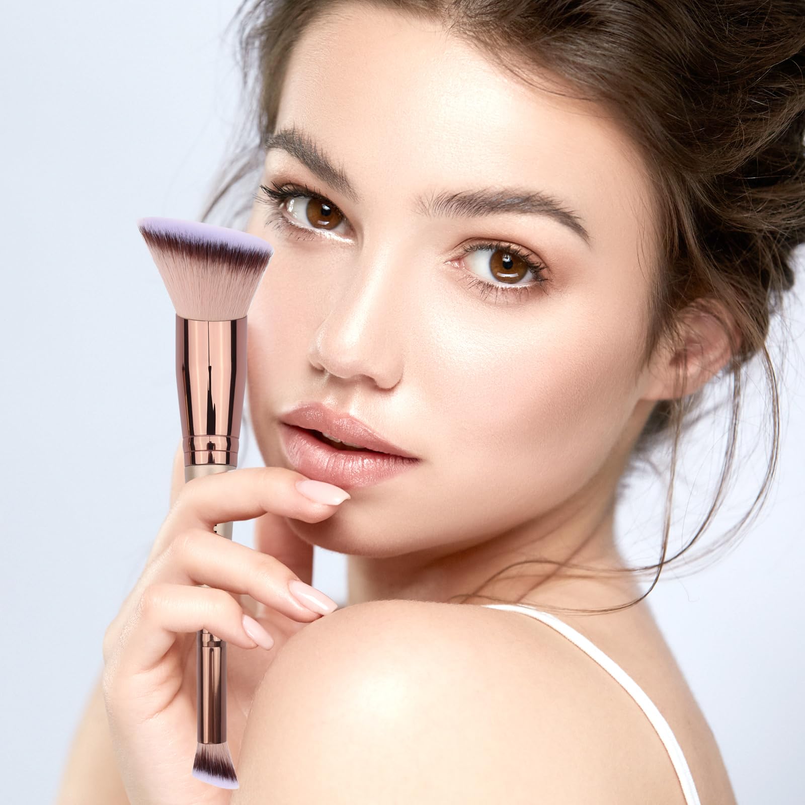 Daubigny dual-ended concealer brush designed for precision blending under eyes.