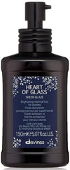 Davines Heart of Glass Sheer Glaze bottle emphasizes heat protection and shine for blonde hair.