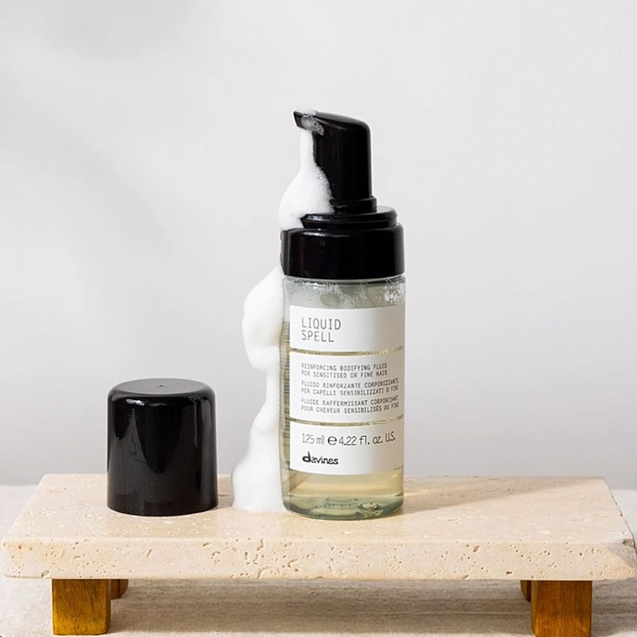 Davines Liquid Spell applied to hair boosts body and movement.