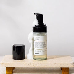 Davines Liquid Spell applied to hair boosts body and movement.