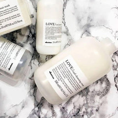 Davines LOVE Curl Cleansing Cream close-up lather demonstrates gentle cleansing.