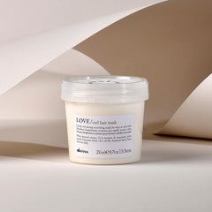 Davines Love Curl Mask label packaging highlighting sustainable beauty for curls.