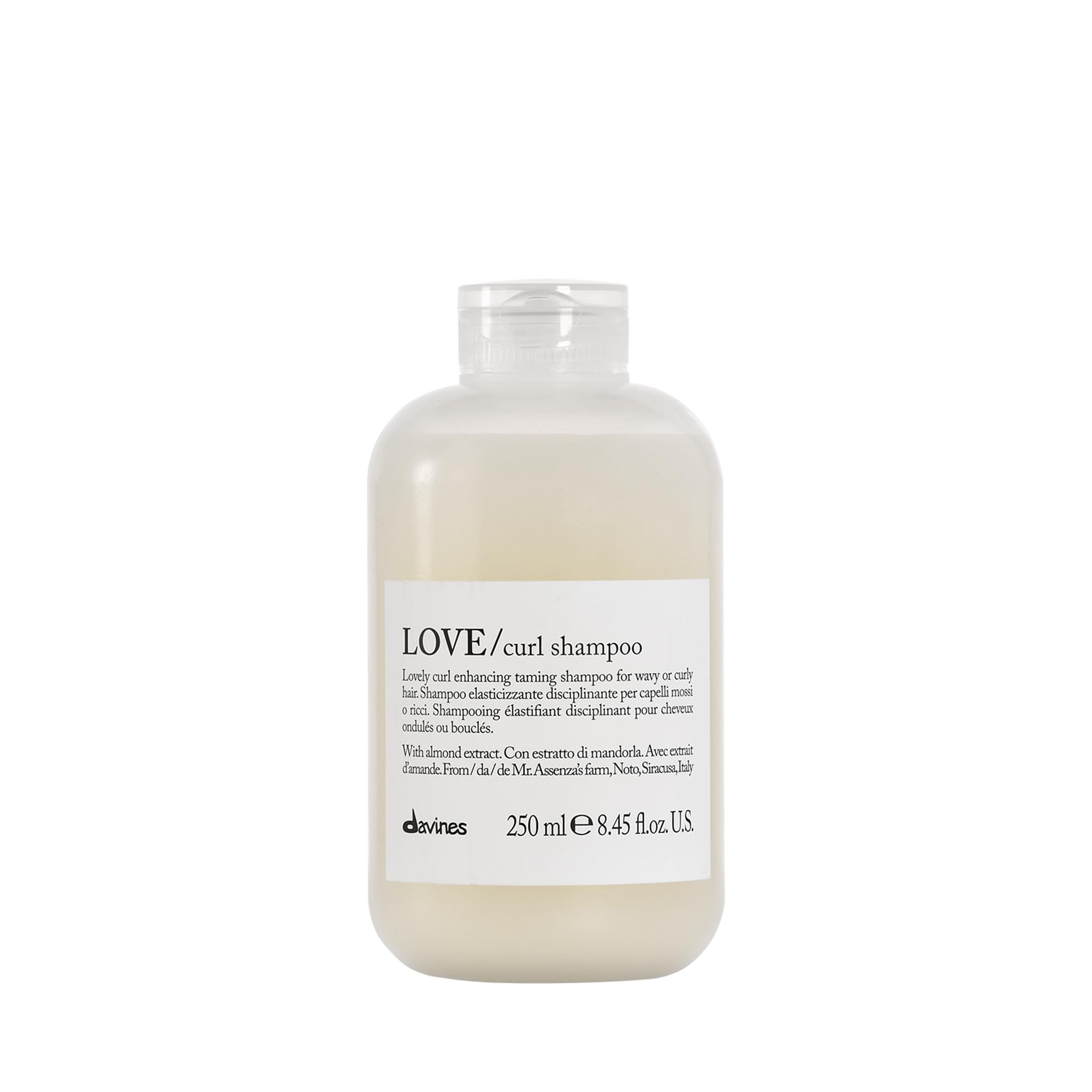Davines LOVE Curl Shampoo bottle on bathroom shelf for curl definition.