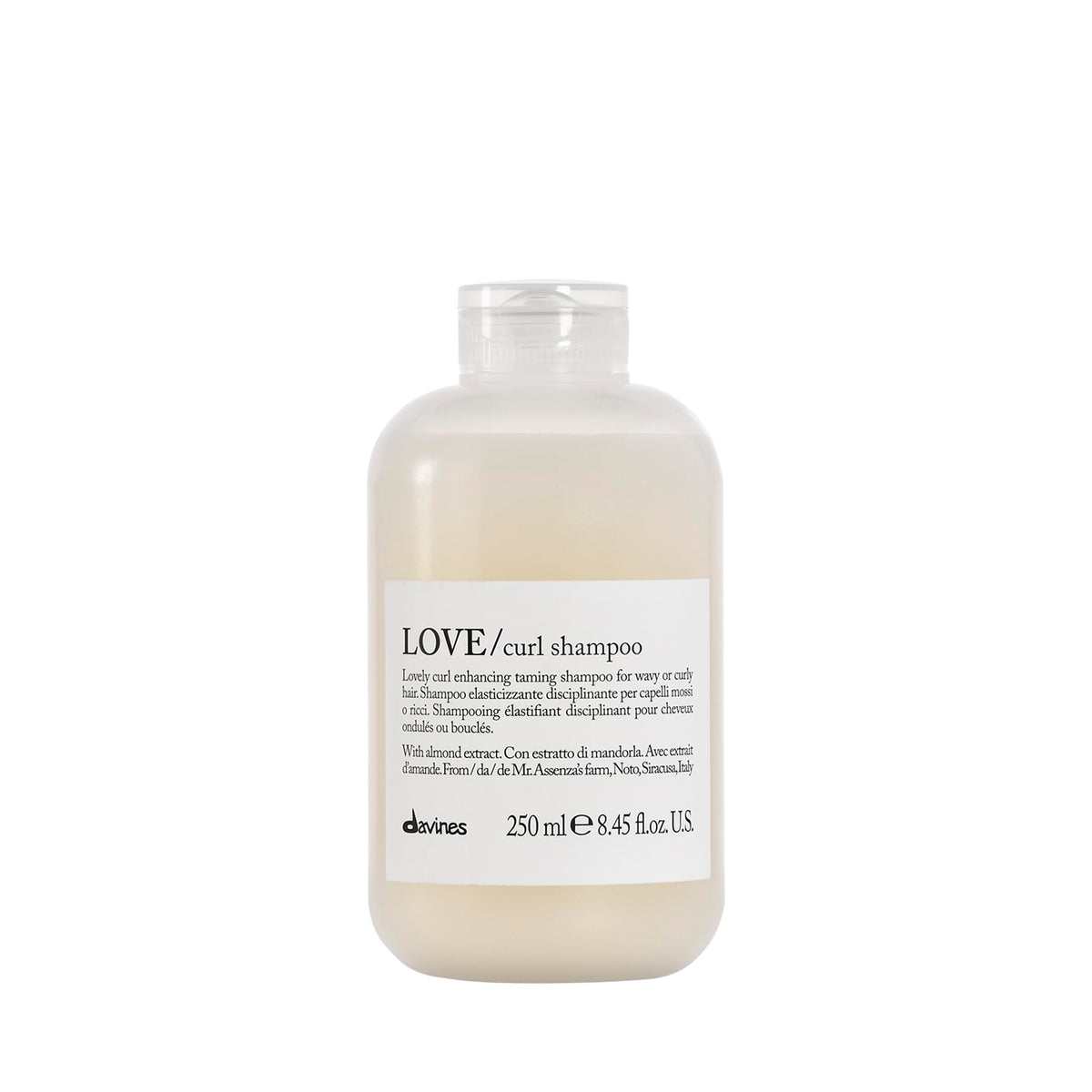 Davines LOVE Curl Shampoo bottle on bathroom shelf for curl definition.