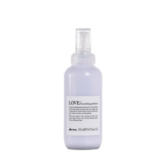 Davines LOVE smoothing perfector serum bottle highlights anti-frizz protection for coarse hair.