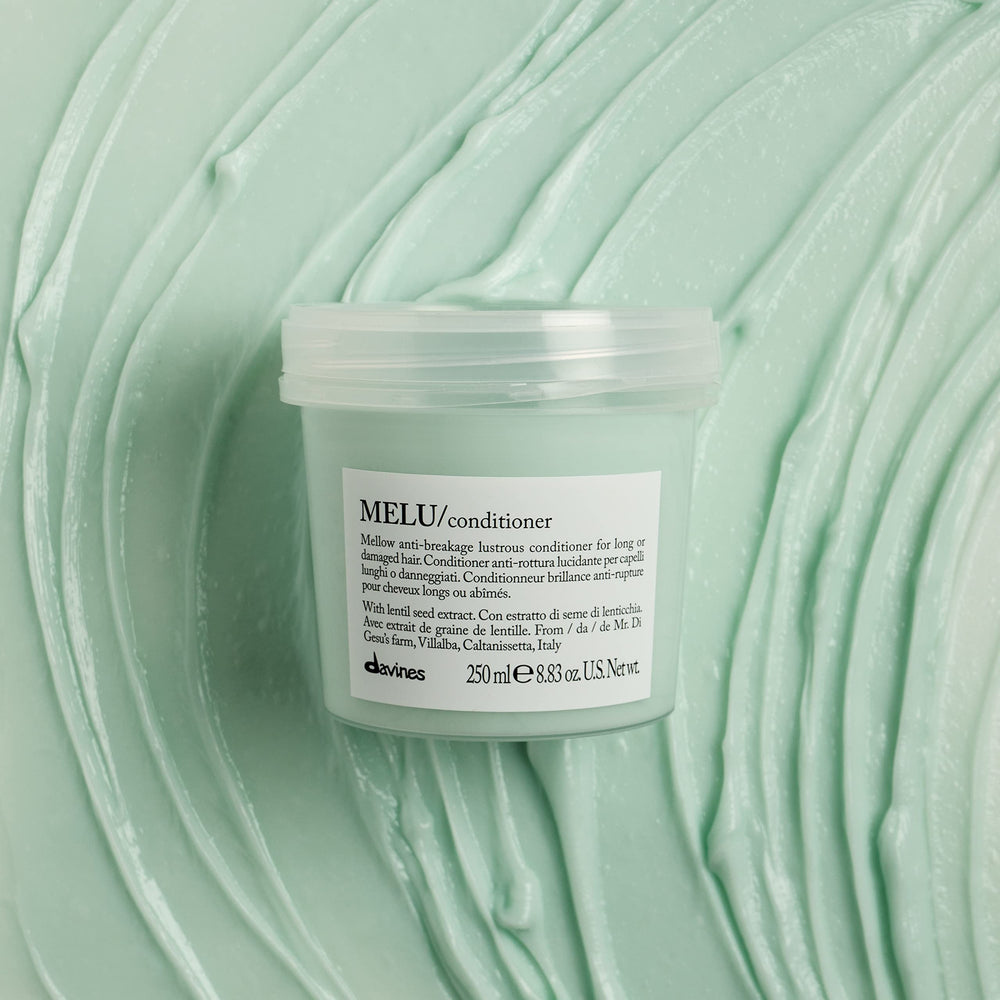MELU texture close-up reveals creamy emollience for dry ends.
