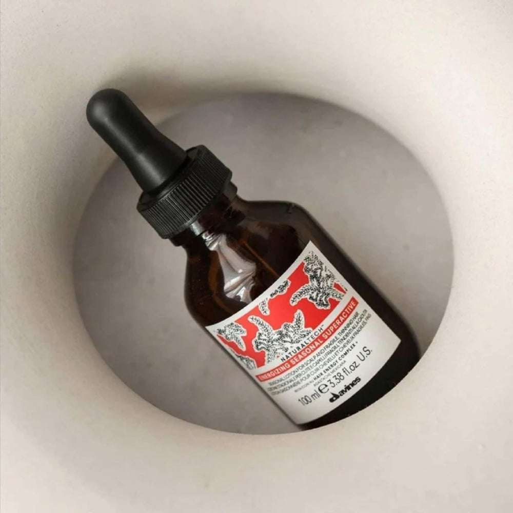 Davines Energizing Seasonal Superactive dispensing demonstrates easy scalp application.