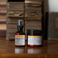 Davines Naturaltech Sealer being applied to towel-dried hair for hydration.