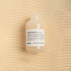 Davines NOUNOU shampoo foamy lather highlights hydrating cleansing for treated hair.