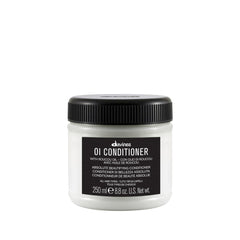 Davines OI Conditioner bottle side view shows smoothing care for hair