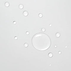 Hair strands reflect glass-like shine after Davines OI Liquid Luster.