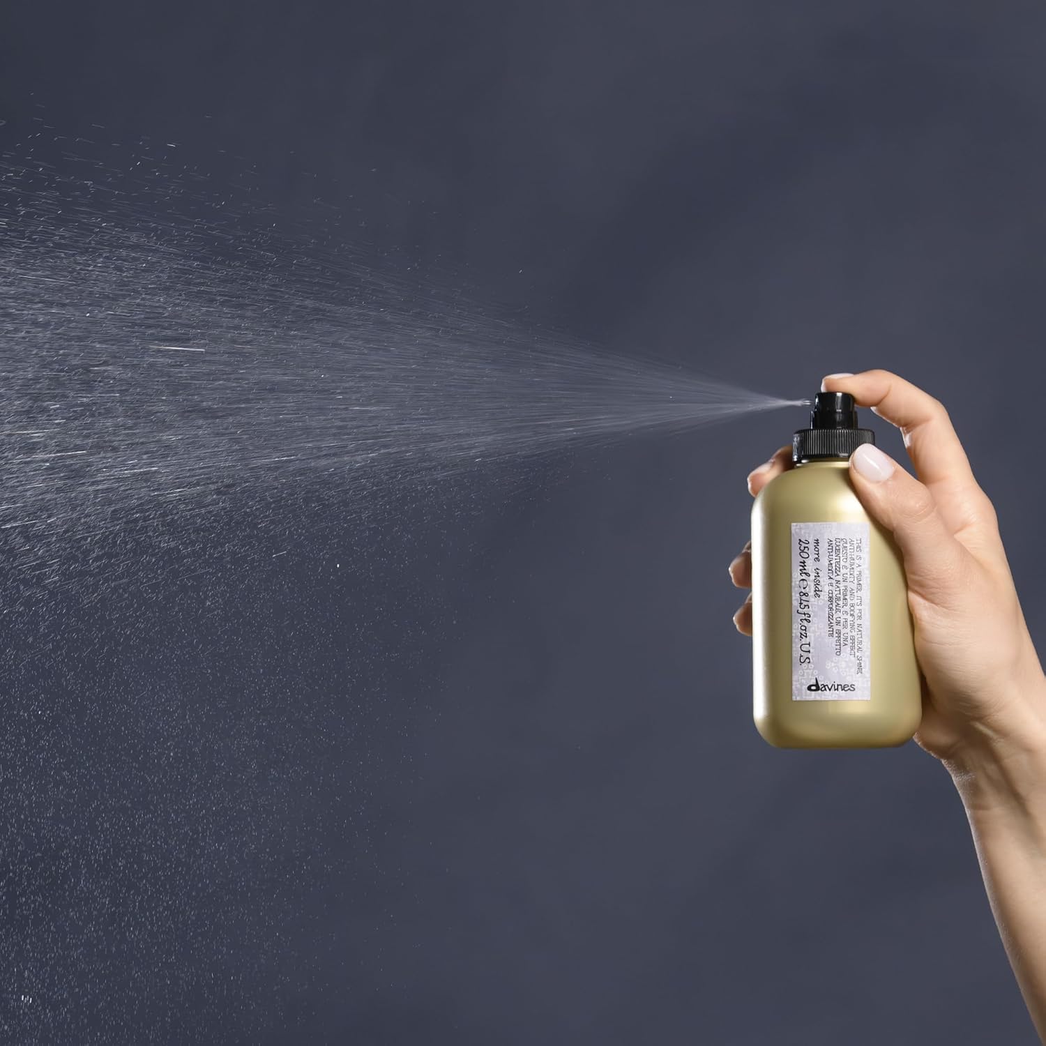 Davines This Is A Blow Dry Primer bottle demonstrates volumized, frizz-controlled results