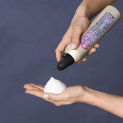 Davines This Is A Curl Moisturizing Mousse creamy texture suggests smooth, defined curls