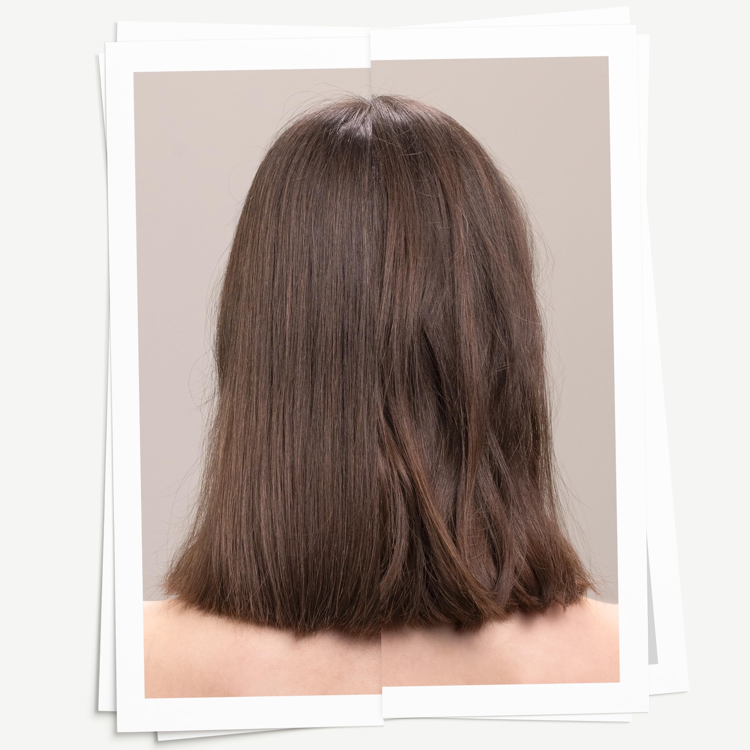 Hands applying Davines sea salt spray to create casual, textured waves.